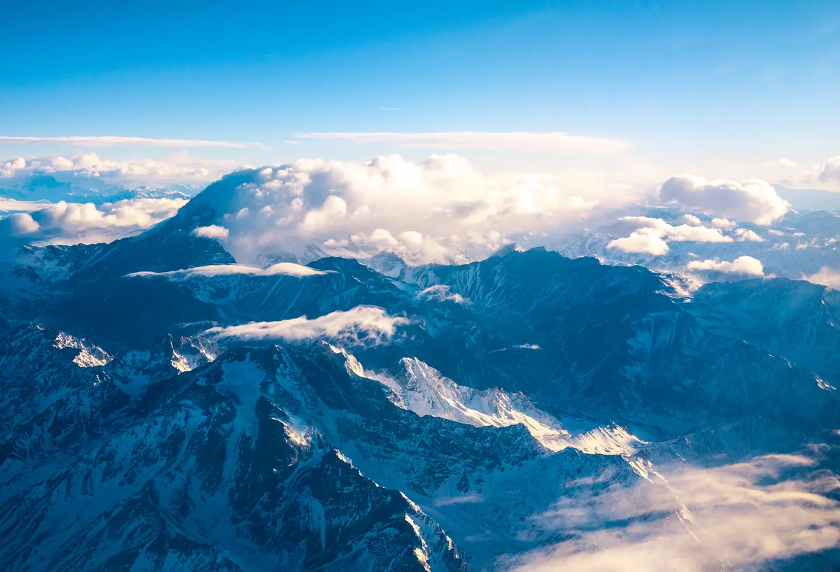 Snow peaks above the clouds